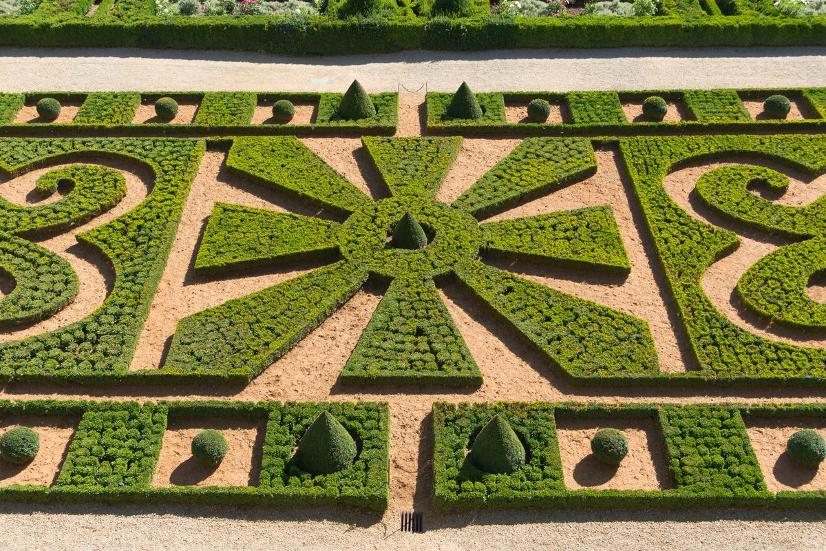 Formal gardens and the Château de Hautefort in Dordogne, France