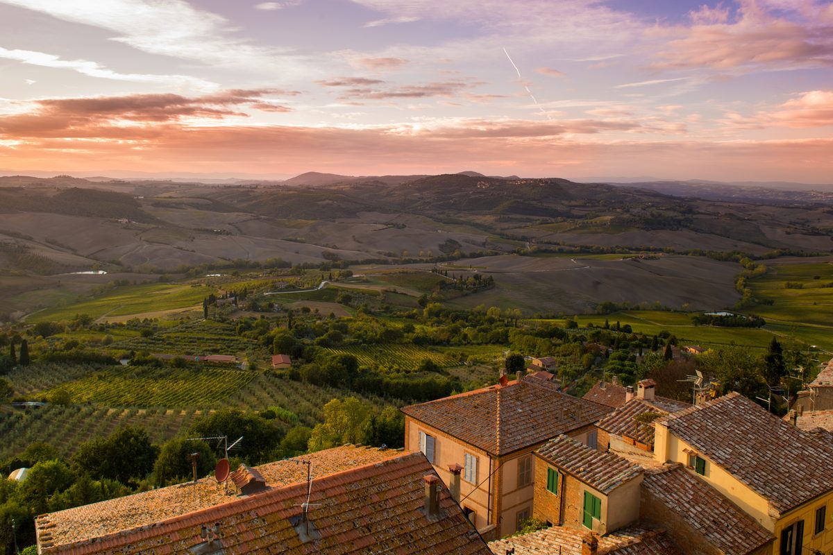 Rolling green hills and cypress trees in Tuscany, Italy