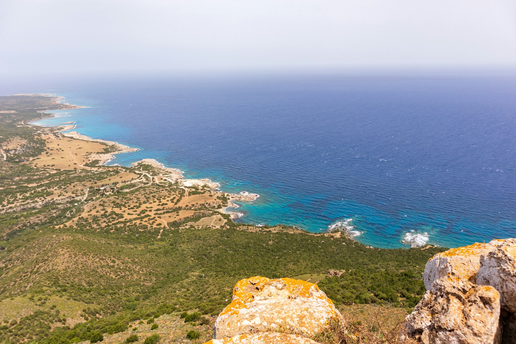 Rugged Akamas coastline in Cyprus with turquoise Mediterranean sea meeting rocky headlands